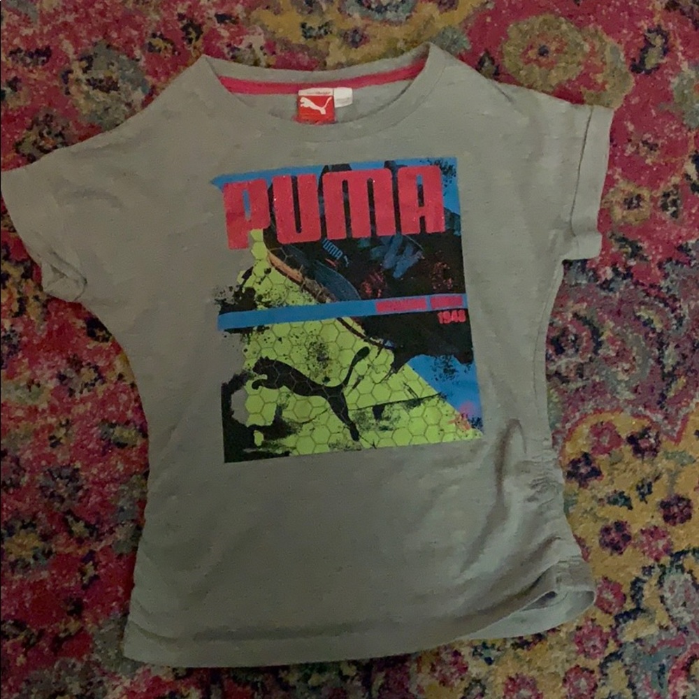 It is a colorful puma tee shirt